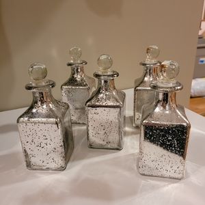 Silver mercury glass bottles with toppers